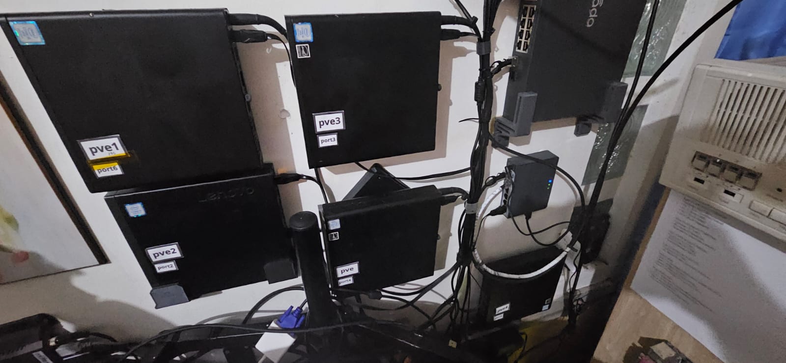 Close-up of the five compute nodes and networking equipment mounted to the wall